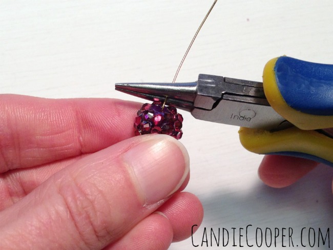 Wrap the wire around the top of the pliers